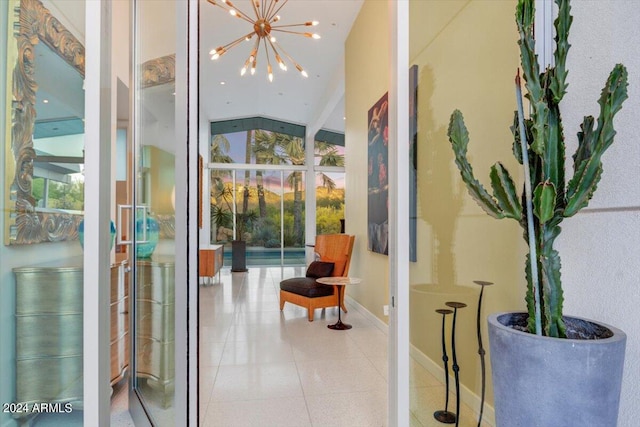 hallway with a notable chandelier, vaulted ceiling with beams, and tile flooring