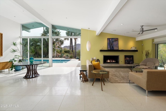 living room with expansive windows, vaulted ceiling with beams, and light tile patterned flooring