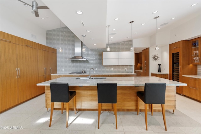 kitchen featuring white cabinets, a large island, and decorative light fixtures