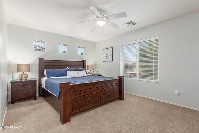 1142 E Mayfield Dr, San Tan Valley, AZ 85143 - bedroom with multiple windows, light colored carpet, baseboards, and a ceiling fan