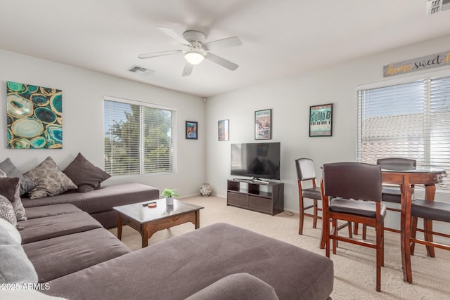 1142 E Mayfield Dr, San Tan Valley, AZ 85143 - living room featuring light carpet, ceiling fan, and baseboards