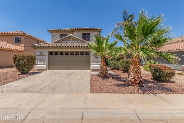 1142 E Mayfield Dr, San Tan Valley, AZ 85143 - mediterranean / spanish house featuring concrete driveway, a garage, stucco siding, and a tiled roof