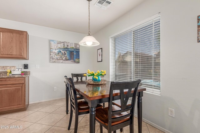 1142 E Mayfield Dr, San Tan Valley, AZ 85143 - dining area with light tile patterned flooring and baseboards