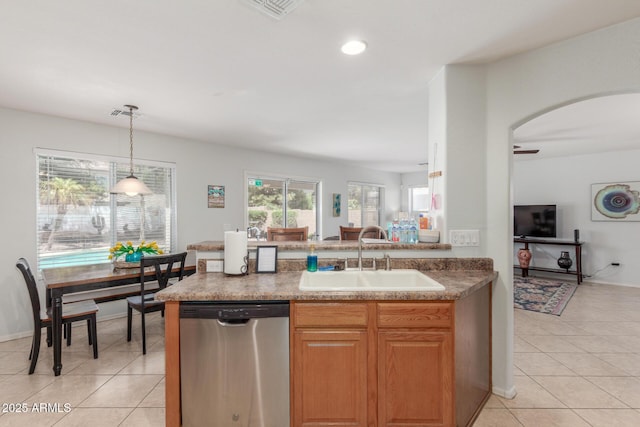 1142 E Mayfield Dr, San Tan Valley, AZ 85143 - kitchen featuring stainless steel dishwasher, a sink, light tile patterned flooring, arched walkways, and recessed lighting