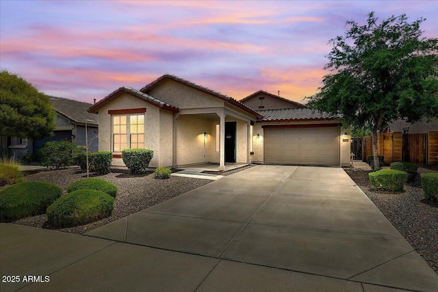 12775 W Lowden Rd, Peoria, AZ 85383 - ranch-style house with stucco siding, an attached garage, driveway, and a tile roof
