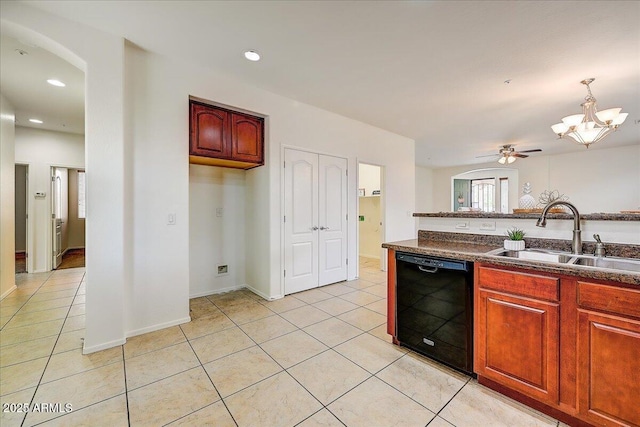 12775 W Lowden Rd, Peoria, AZ 85383 - kitchen featuring black dishwasher, a sink, arched walkways, light tile patterned flooring, and dark countertops