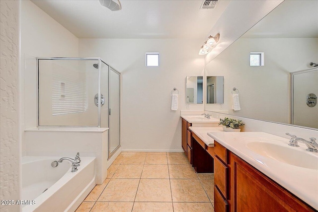 12775 W Lowden Rd, Peoria, AZ 85383 - full bathroom with double vanity, a stall shower, a garden tub, and tile patterned flooring