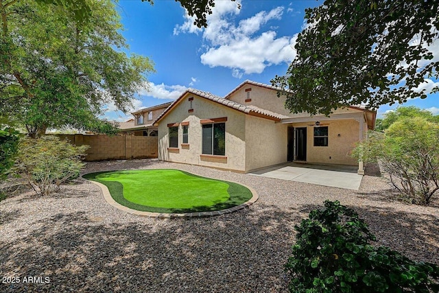 12775 W Lowden Rd, Peoria, AZ 85383 - rear view of property with stucco siding, a fenced backyard, a patio, and a tiled roof
