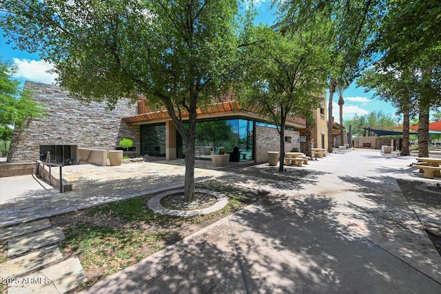 12775 W Lowden Rd, Peoria, AZ 85383 - back of property featuring stone siding and a patio