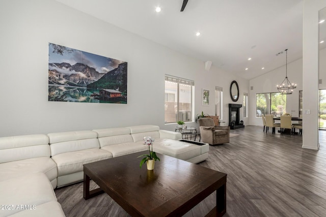 723 E Gemini Pl, Chandler, AZ 85249 - living area with wood finished floors, a chandelier, recessed lighting, high vaulted ceiling, and a fireplace