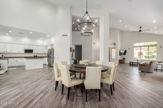 723 E Gemini Pl, Chandler, AZ 85249 - dining area featuring high vaulted ceiling, light wood-style floors, a chandelier, recessed lighting, and ceiling fan