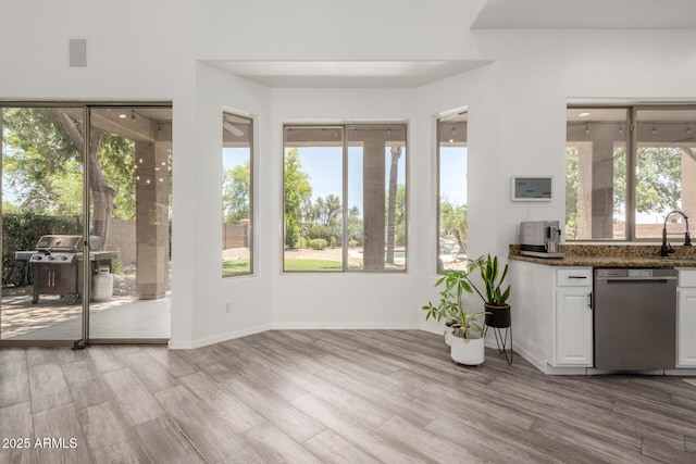 723 E Gemini Pl, Chandler, AZ 85249 - kitchen featuring dishwasher, light wood-style flooring, white cabinets, and plenty of natural light