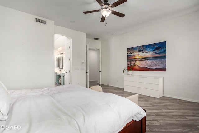723 E Gemini Pl, Chandler, AZ 85249 - bedroom with arched walkways, wood finished floors, a ceiling fan, and connected bathroom