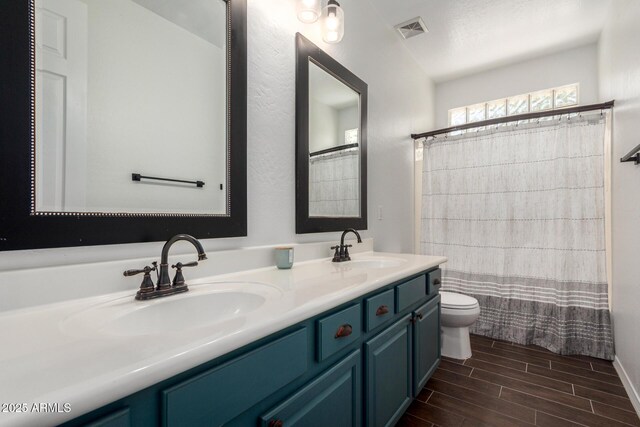 723 E Gemini Pl, Chandler, AZ 85249 - bathroom featuring double vanity, wood finished floors, and a shower with shower curtain