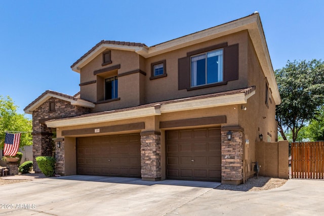 723 E Gemini Pl, Chandler, AZ 85249 - view of front facade featuring stone siding, driveway, and stucco siding