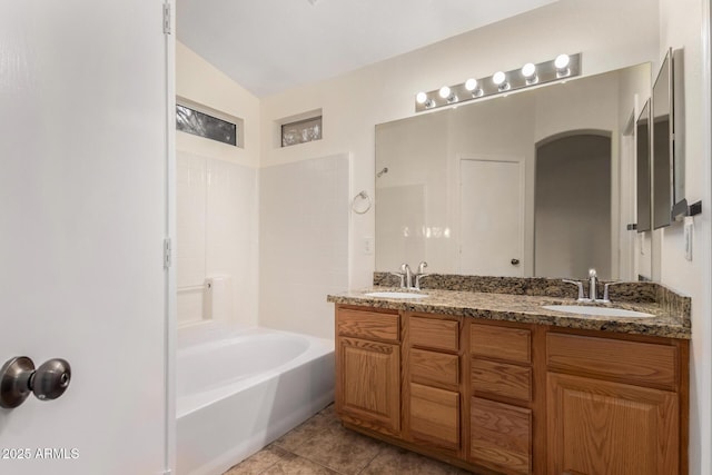 bathroom featuring tile patterned floors, vanity, and bathtub / shower combination