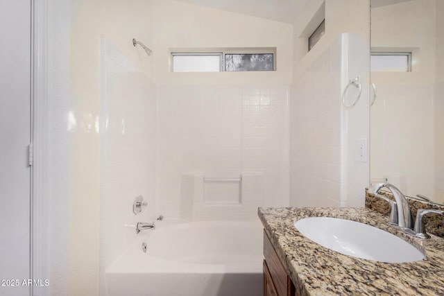 bathroom with vanity and shower / tub combination