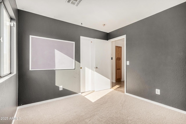 interior space featuring light colored carpet