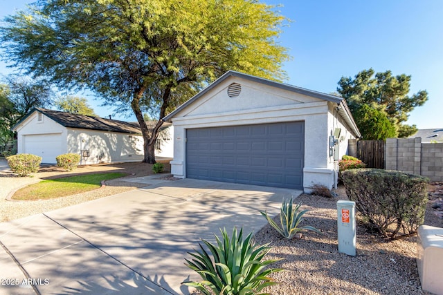 view of front of house with an outbuilding and a garage