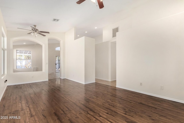 spare room with ceiling fan and dark hardwood / wood-style floors