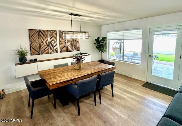 dining space featuring light wood-type flooring