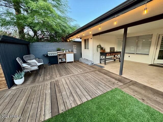 wooden deck with a patio