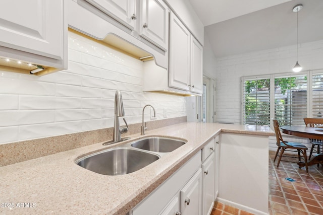 4800 N 68th St Unit 357, Scottsdale, AZ 85251 - kitchen featuring a sink, white cabinets, and backsplash