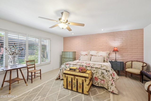 4800 N 68th St Unit 357, Scottsdale, AZ 85251 - bedroom with brick wall and light wood-style floors
