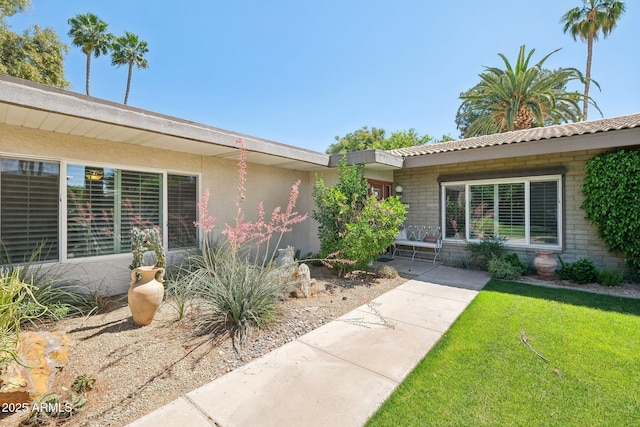 4800 N 68th St Unit 357, Scottsdale, AZ 85251 - property entrance featuring stucco siding and a lawn