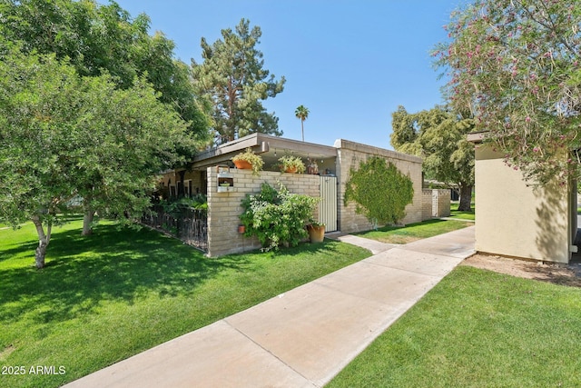 4800 N 68th St Unit 357, Scottsdale, AZ 85251 - view of home's exterior with a yard
