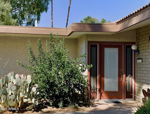 4800 N 68th St Unit 357, Scottsdale, AZ 85251 - view of exterior entry with stucco siding