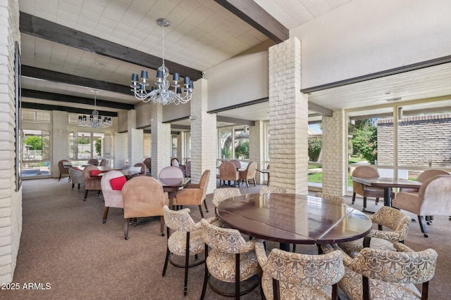 4800 N 68th St Unit 357, Scottsdale, AZ 85251 - carpeted dining space featuring beamed ceiling, a chandelier, plenty of natural light, decorative columns, and a towering ceiling