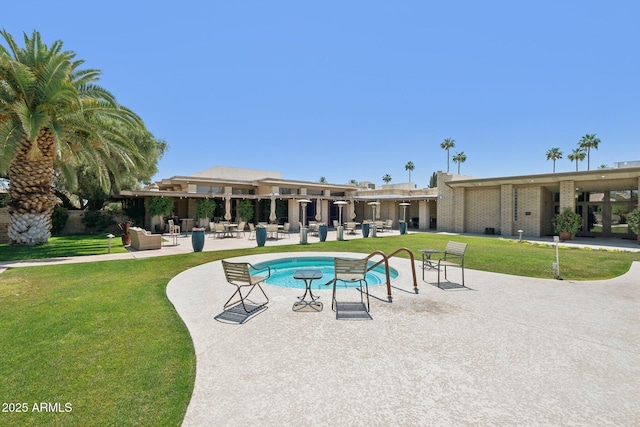 4800 N 68th St Unit 357, Scottsdale, AZ 85251 - view of swimming pool with a patio, a swimming pool, and a yard