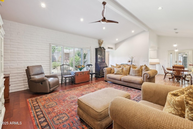 4800 N 68th St Unit 357, Scottsdale, AZ 85251 - living area featuring healthy amount of natural light, a ceiling fan, wood finished floors, brick wall, and beamed ceiling