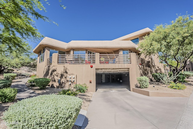 10222 E Southwind Ln Unit 1018, Scottsdale, AZ 85262 - view of property with driveway and a garage