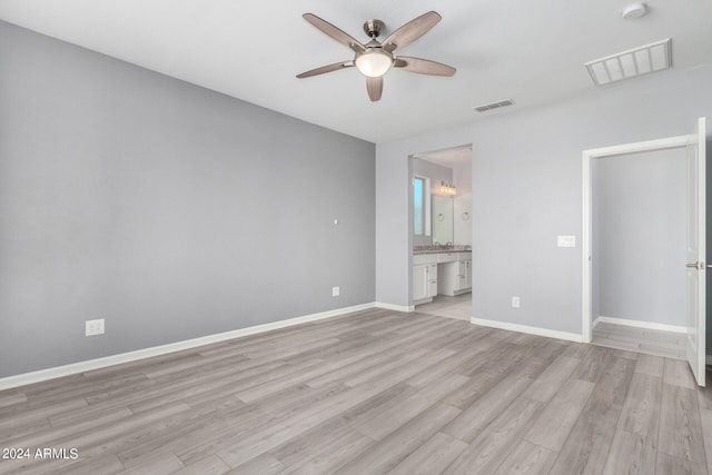 unfurnished bedroom with ceiling fan, light hardwood / wood-style flooring, and ensuite bathroom