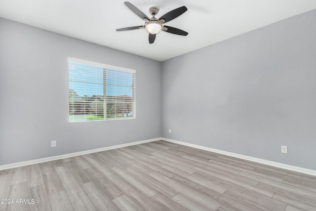 unfurnished room featuring light wood-type flooring and ceiling fan