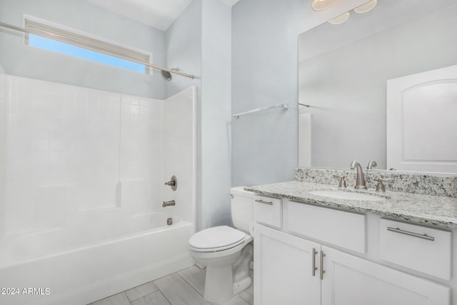 full bathroom featuring tile patterned floors, shower / washtub combination, vanity, and toilet