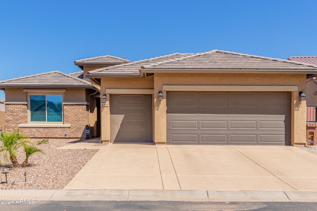 prairie-style home featuring a garage