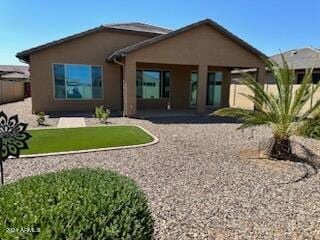 rear view of house with a patio