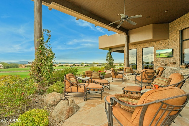 view of patio / terrace featuring ceiling fan