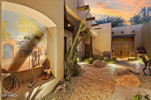 view of patio terrace at dusk