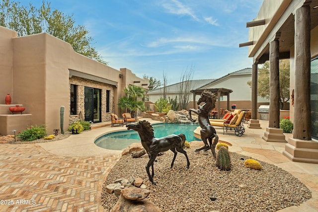 view of swimming pool with a pergola and a patio