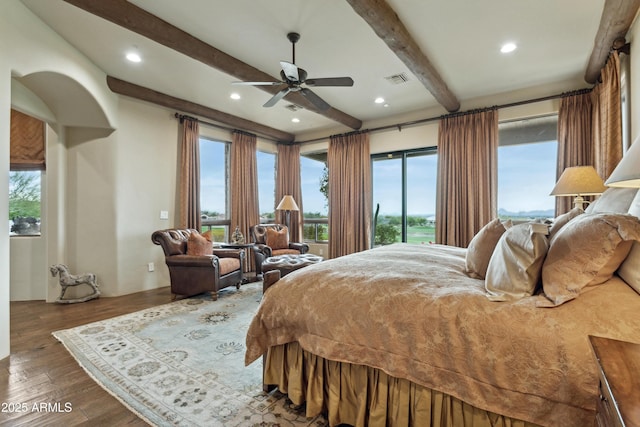 bedroom with wood-type flooring, access to exterior, and beam ceiling