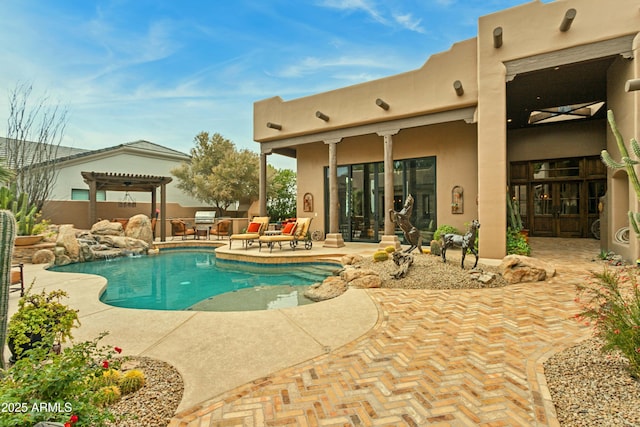 view of swimming pool featuring a pergola and a patio area