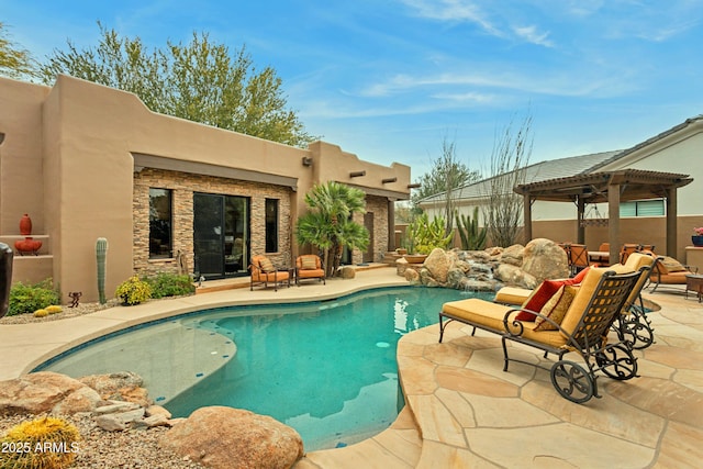 view of pool with a pergola and a patio area