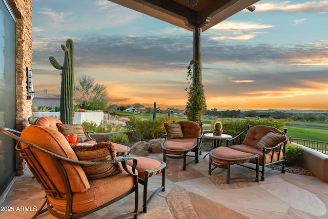 view of patio terrace at dusk