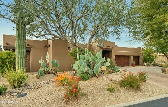 southwest-style home with a garage