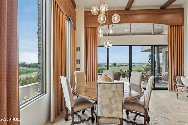 dining area with beamed ceiling