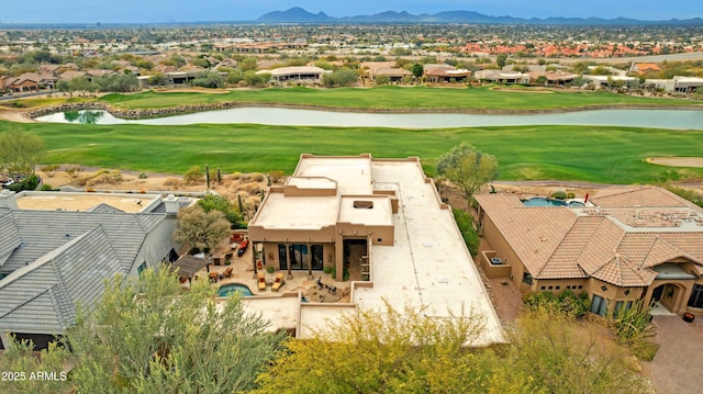 birds eye view of property with a water and mountain view